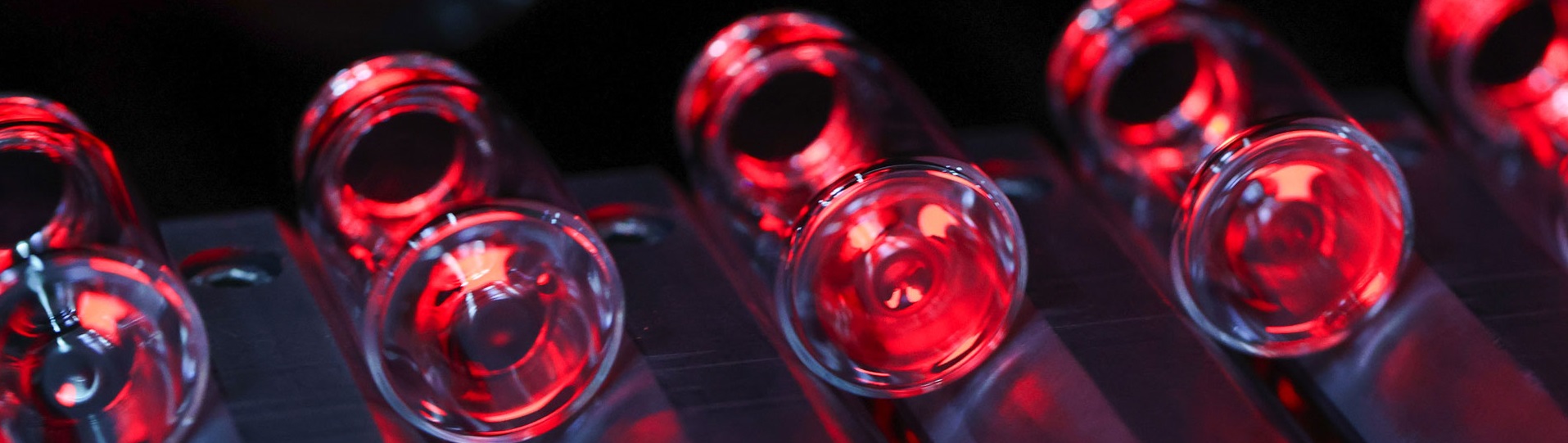 An abstract image of vials under red light