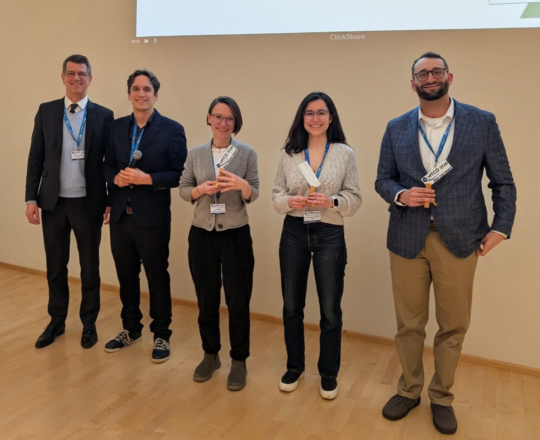 A photograph of 5 people