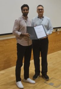 Presentation of poster prize certificate to Ahmed Omara