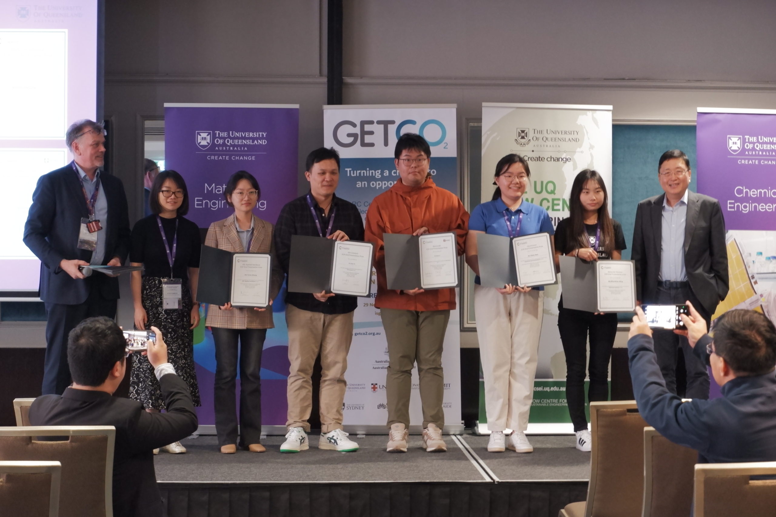 Alan Rowan, Zi Sophia Gu and Shizhang Qiao stood beside Yurou Zhang, Chao Ye, Huan Li, Chen Han and Shanshan Ding holding their presentation prize certificates.