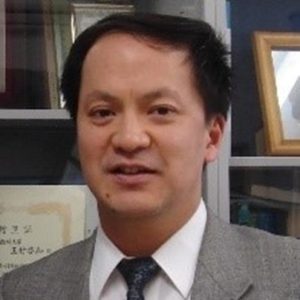Hirokazu Tamamura wearing a suit