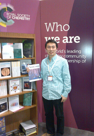 Wei Luo with a copy of ChemComm