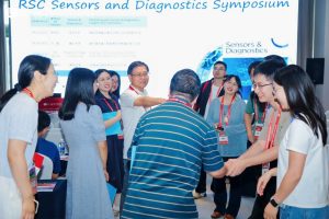 Prof. Zhang meets colleagues at the conference.