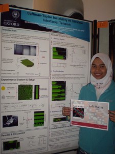 Photograph of Siti Aminah Setu standing in front of her winning poster