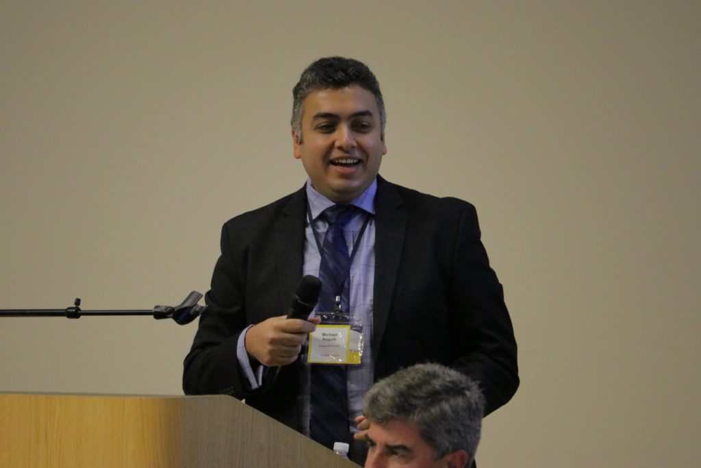 Professor Michael Naguib smiles while presenting at the 2nd MXene Conference at Drexel University